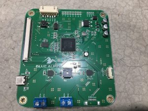 Green digital PCB board built around a SAMD51 microcontroller, part E00108-00
